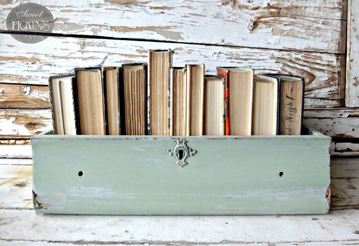 Wooden drawer painted Oh Olive! by Old Fashioned Milk Paint, repurposed as a book holder.