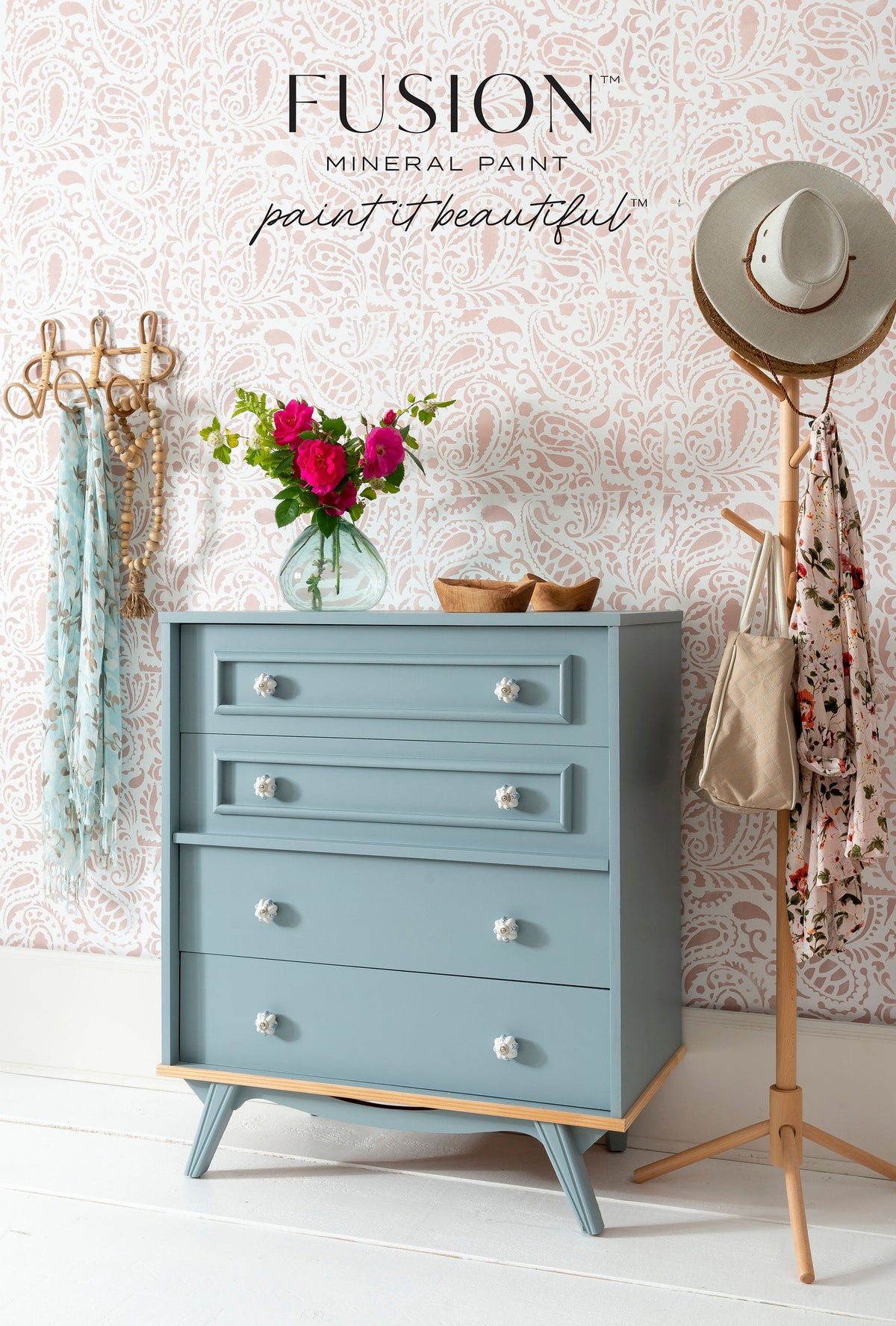 Light blue dresser painted in Fusion Mineral Paint Paisley, matte finish, glass knobs.