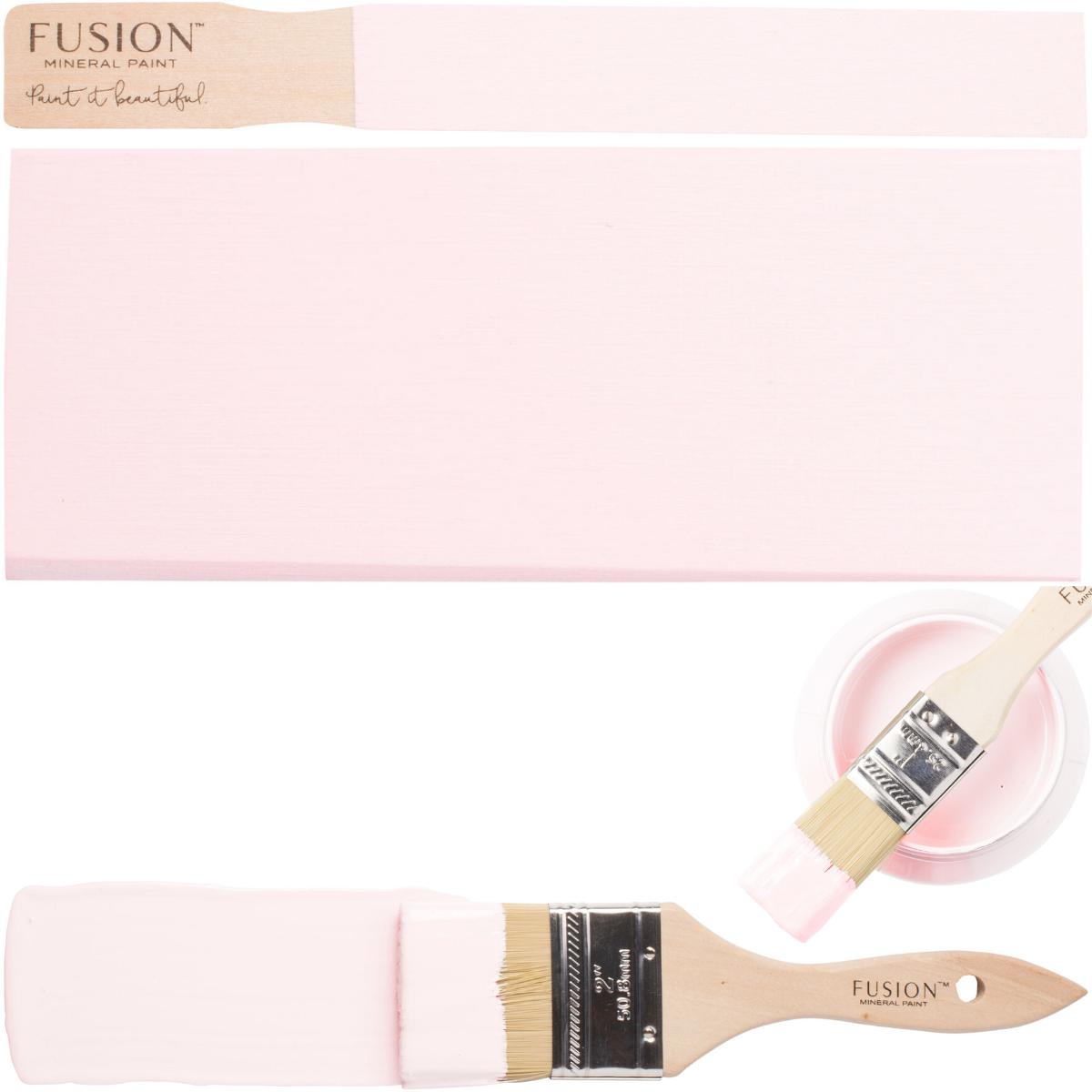 Brush, painted stick, and open container of Peony Fusion Mineral Paint in matching pink.
