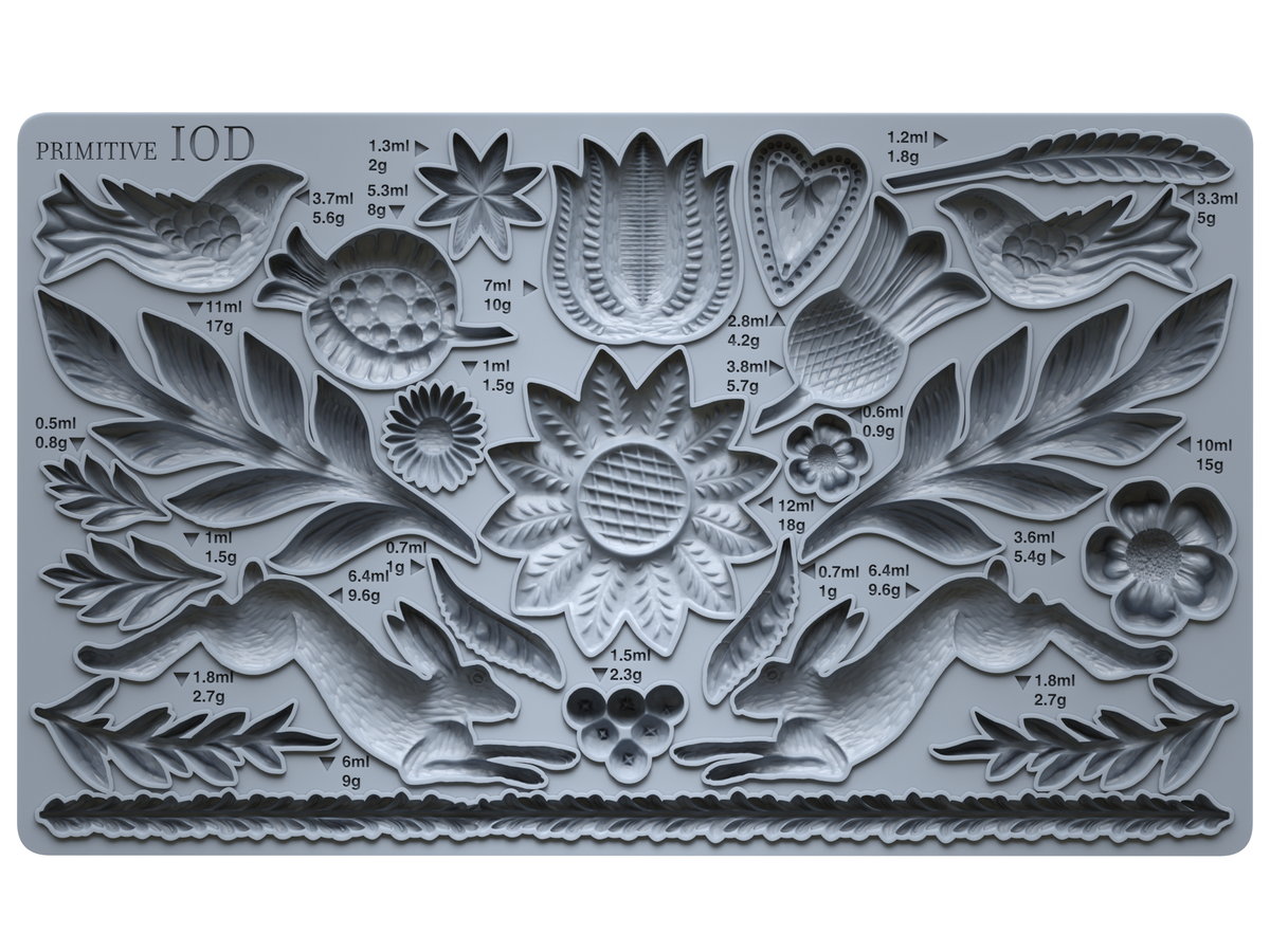 Primitive Mould by IOD, gray silicone mold with floral, leaf, rabbit, and bird designs labeled with volume and weight.