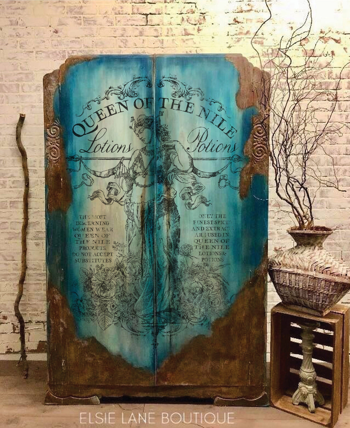 Vintage blue armoire featuring I.O.D. Queen of the Nile Paint Inlay and rustic wicker décor accents.