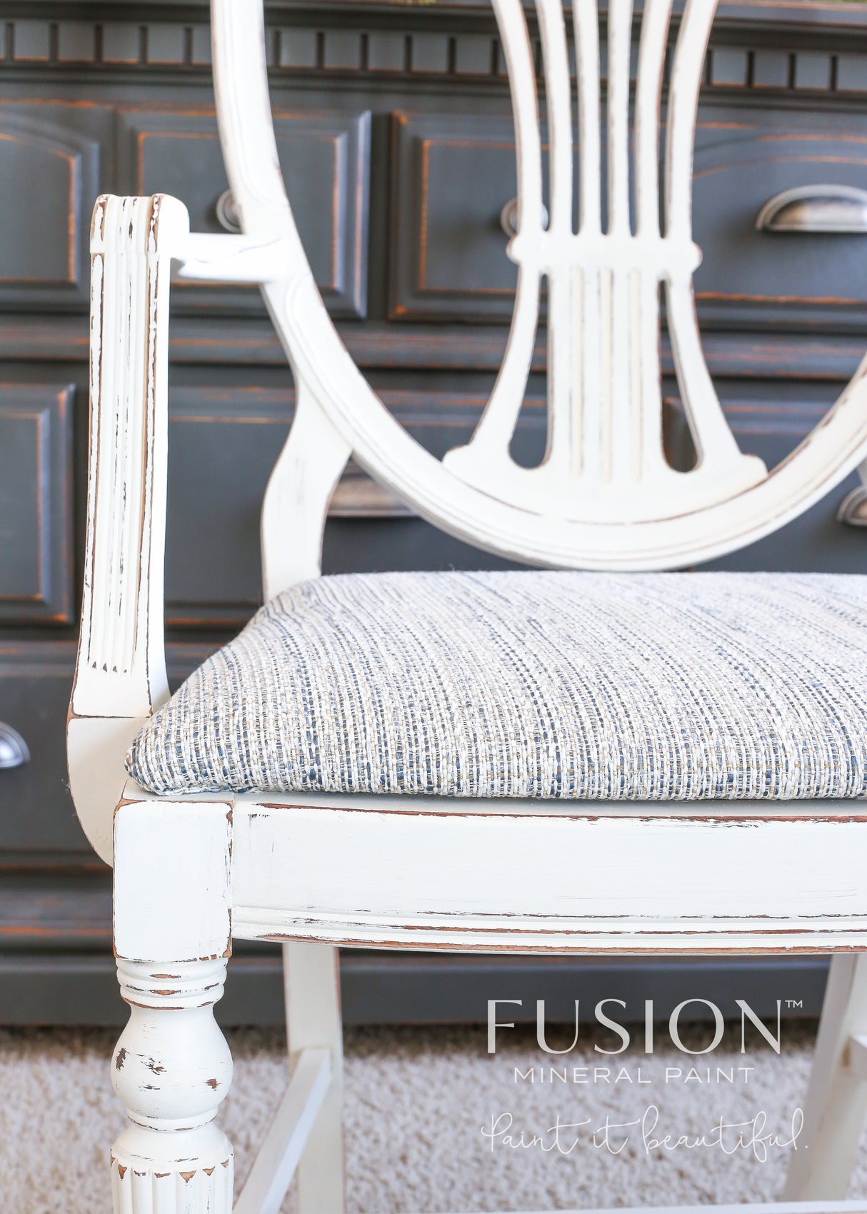 White distressed chair with striped seat, painted in Raw Silk Fusion Mineral Paint.