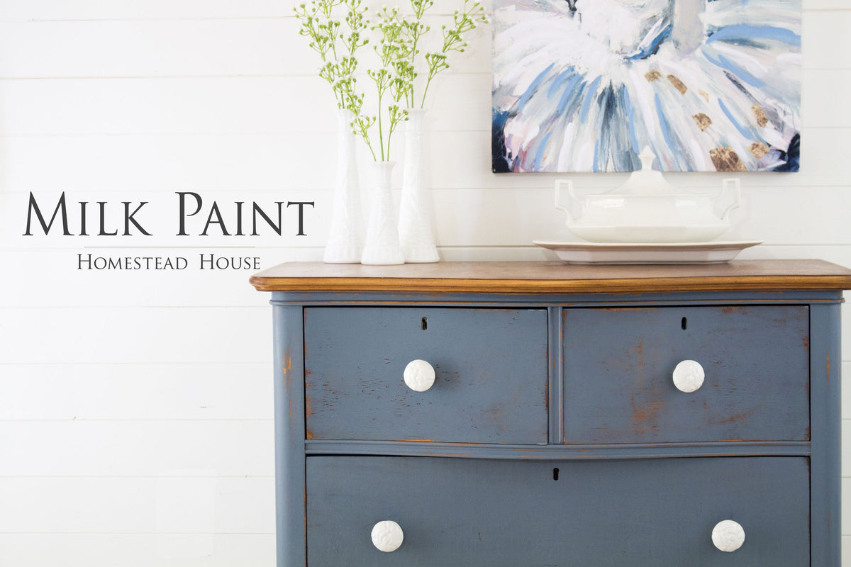 Blue wooden dresser in Homestead House Rideau Blue Milk Paint with white knobs.