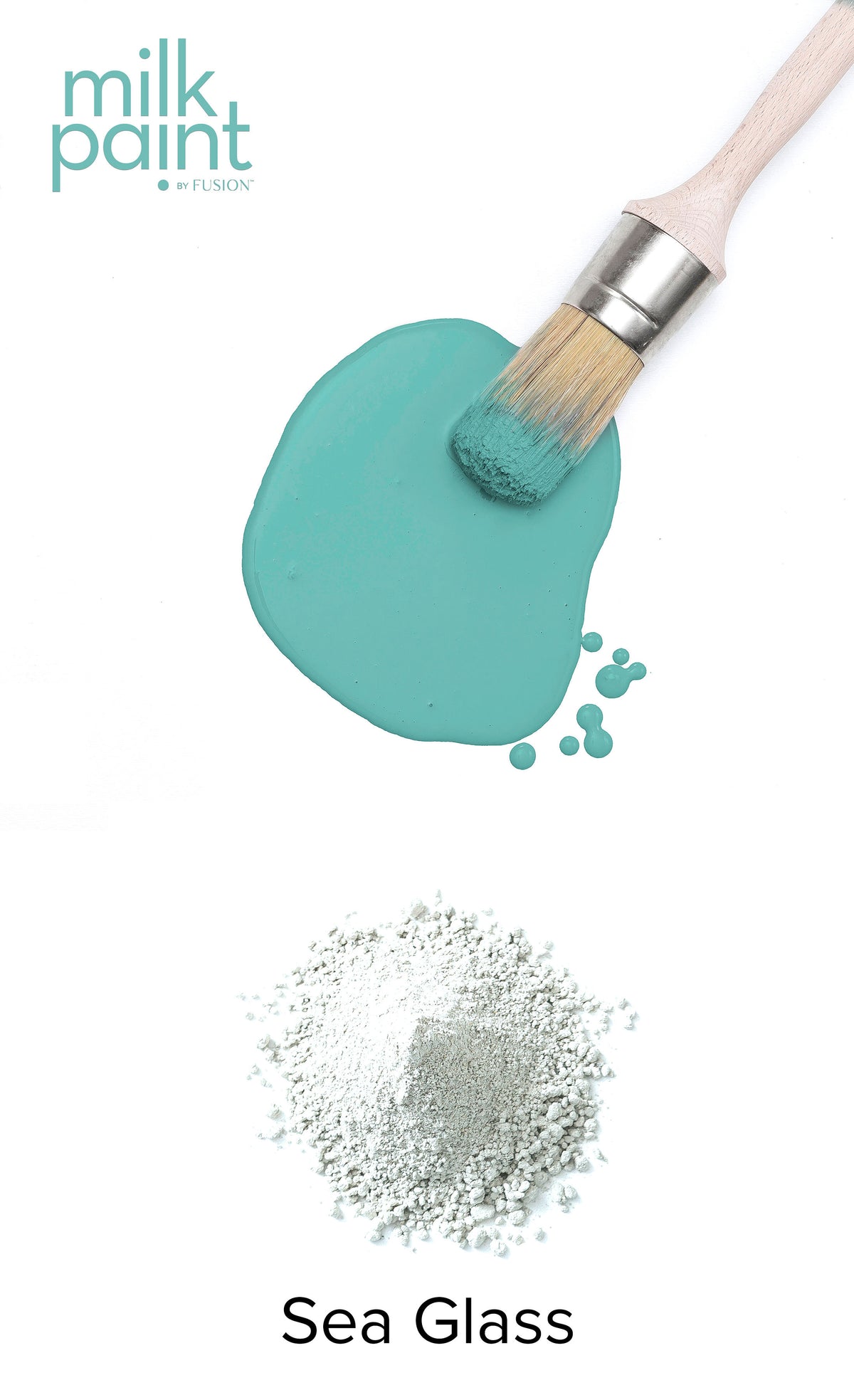 Fusion Mineral Paint brush resting on spilled Sea Glass paint atop white powder labeled Sea Glass.