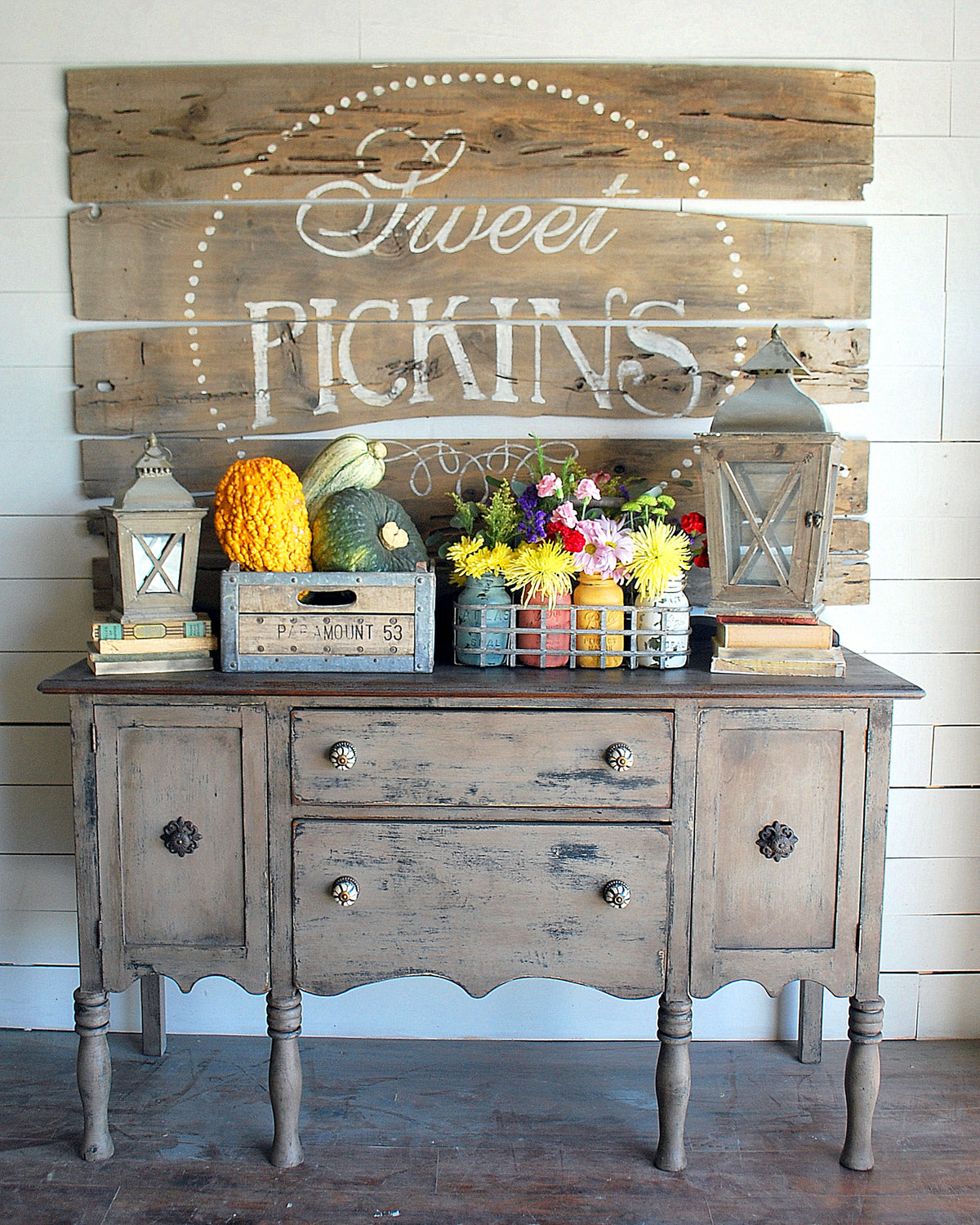 Rustic sideboard with fall decor beneath Suitcase – Sweet Pickins Milk Paint sign by Old Fashioned Milk Paint.