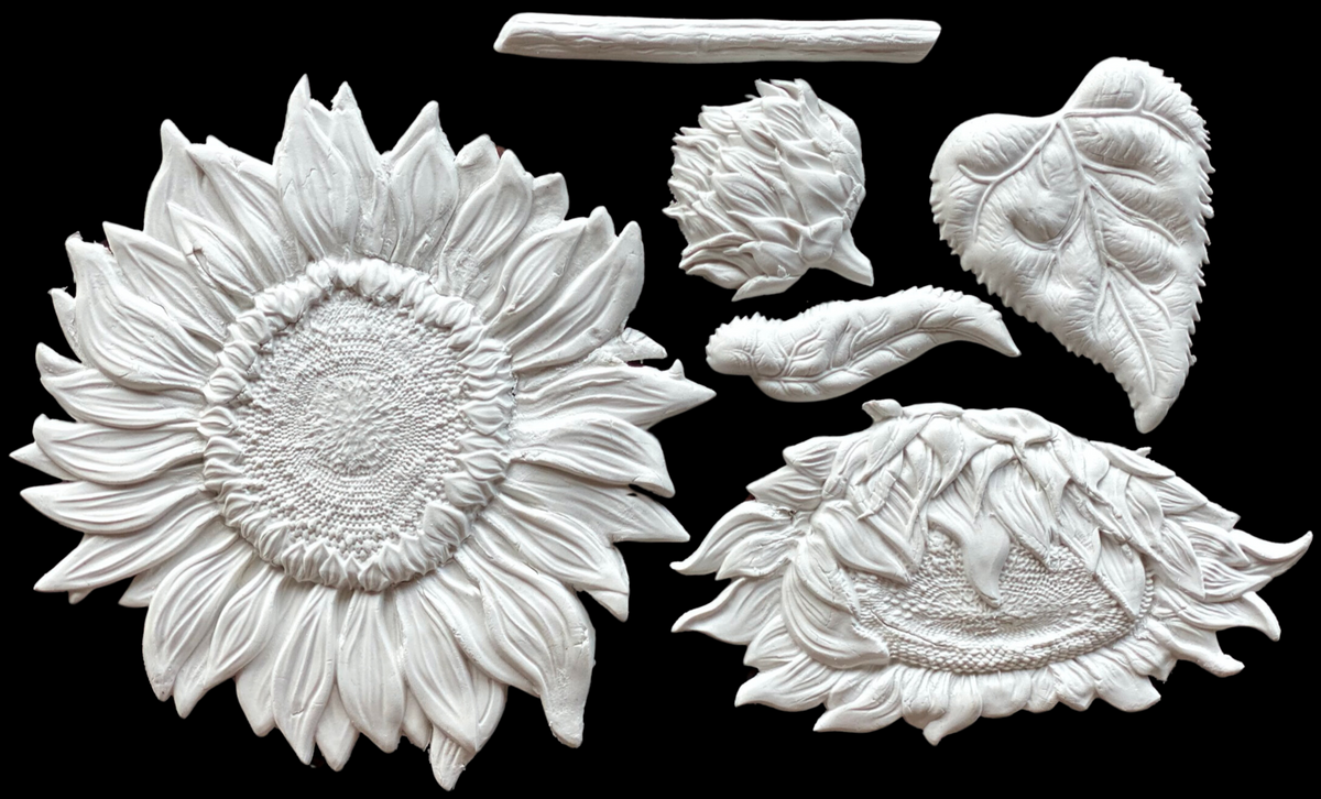 White clay sunflowers made with I.O.D. Sunflowers Mould; includes bloom, bud, stem, and leaves.