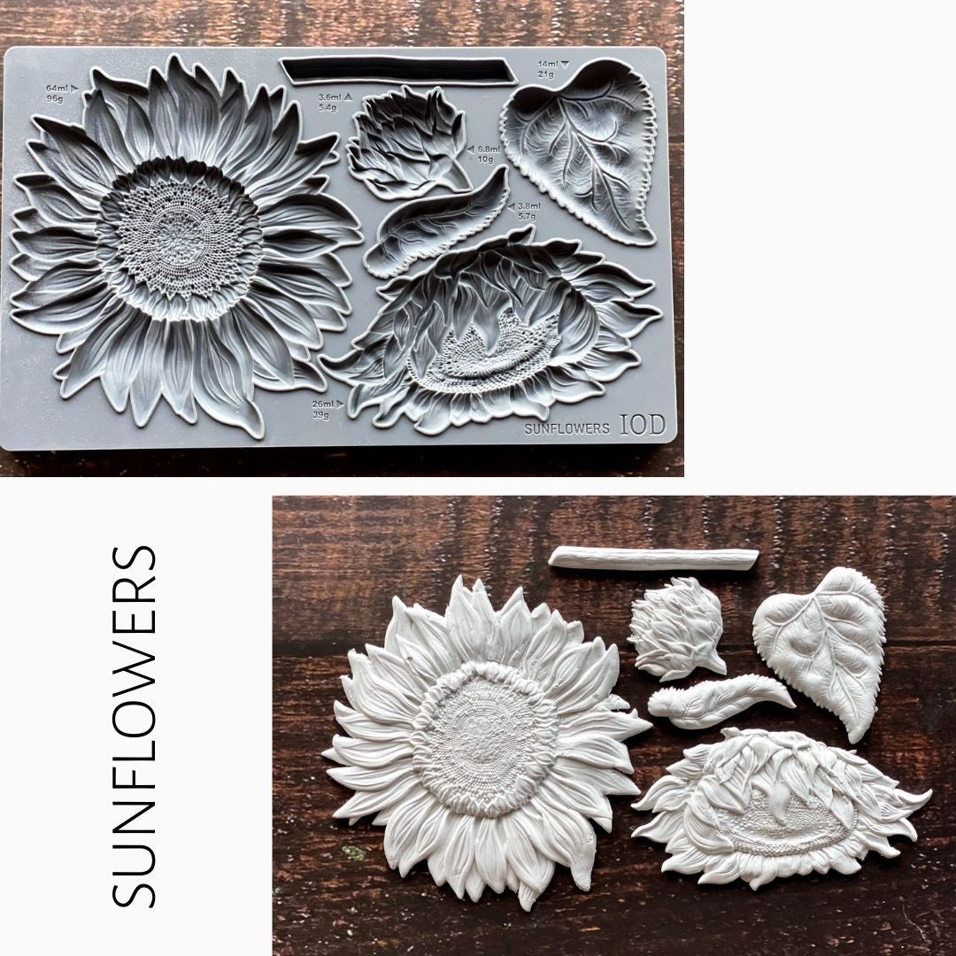 IOD Sunflowers Mould with finished white resin sunflower pieces displayed on a wooden surface.