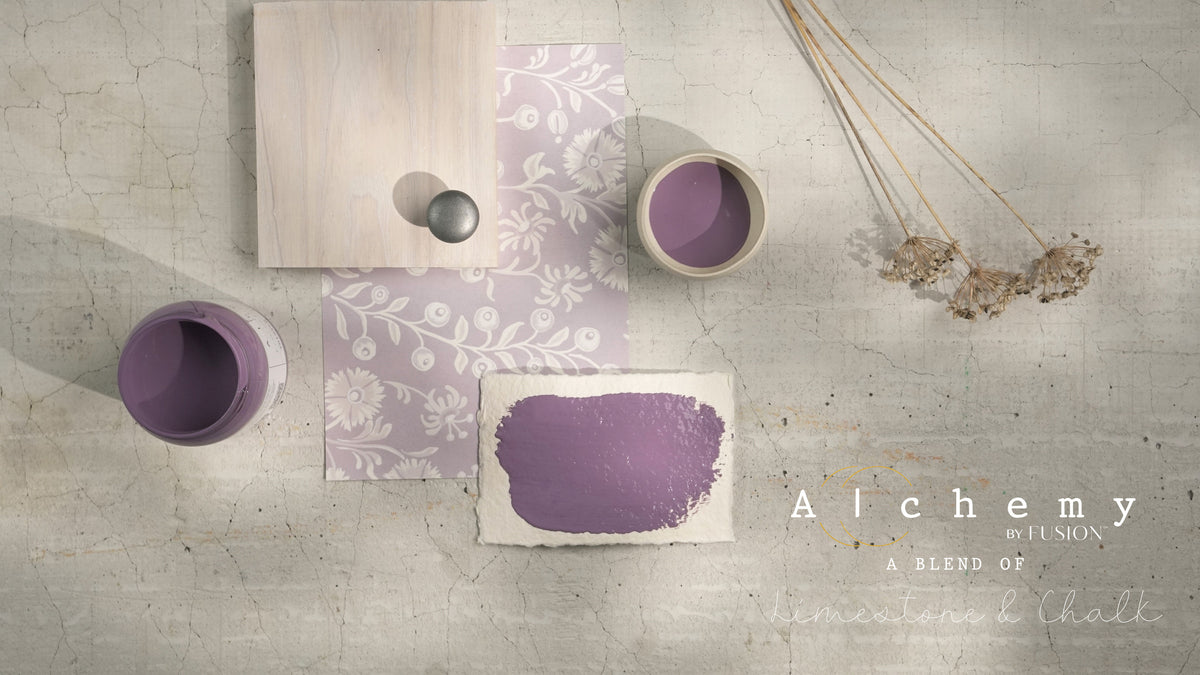 Thistle Alchemy Paint by Fusion Mineral Paint with brush, floral paper, dried flowers, and card on cracked surface.