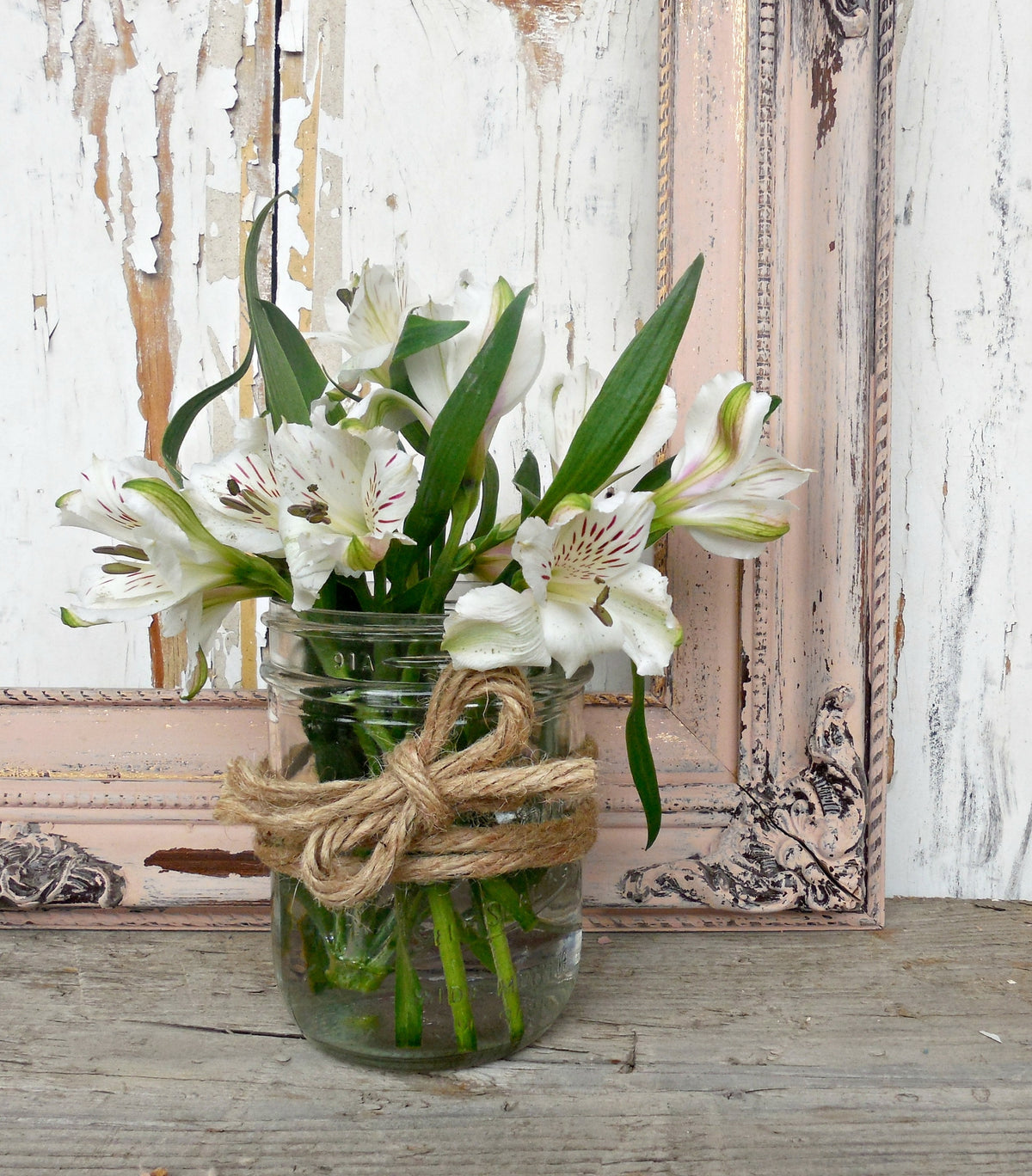 White lilies in a jar on rustic wood, with Tickled Pink – Sweet Pickins Milk Paint by Old Fashioned Milk Paint frame.