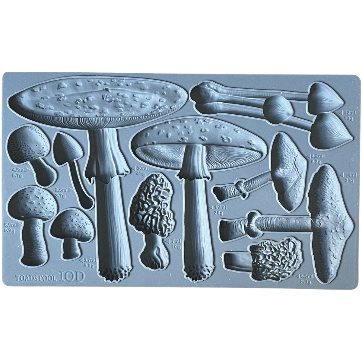IOD Toadstool Mould with assorted mushroom shapes, each marked with milliliter measurements. Brand: I.O.D.