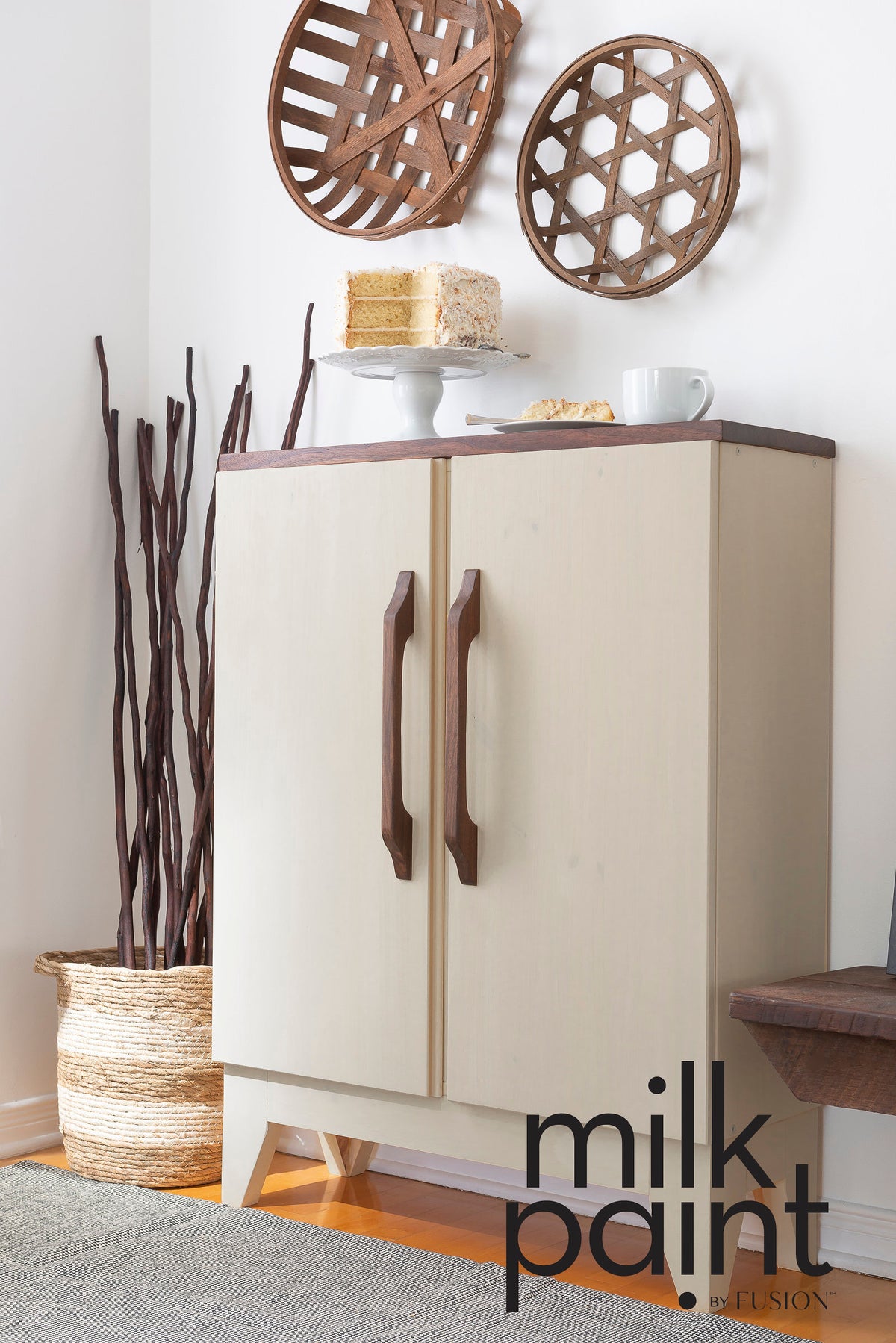 Cream cabinet with wooden handles, finished in Toasted Coconut Paint by Fusion Mineral Paint, natural accents shown.