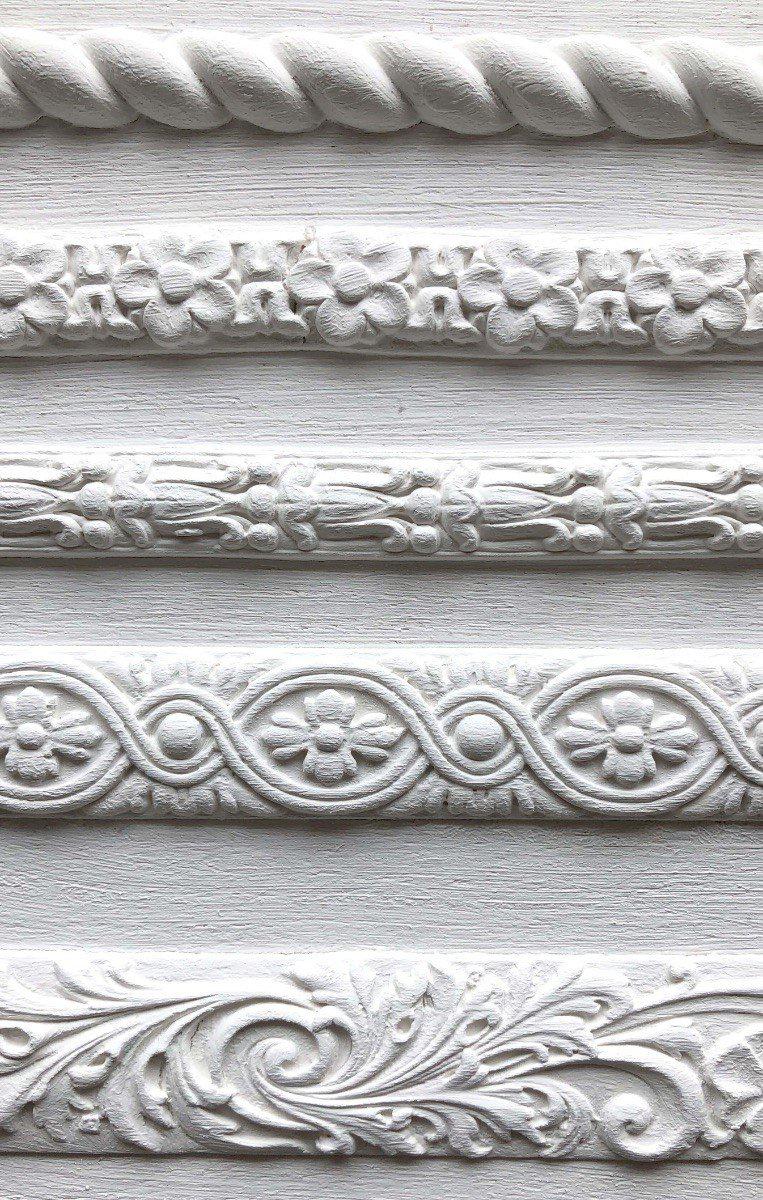 Five I.O.D. Trimmings 2 Moulds with parallel rows of floral and geometric designs displayed.