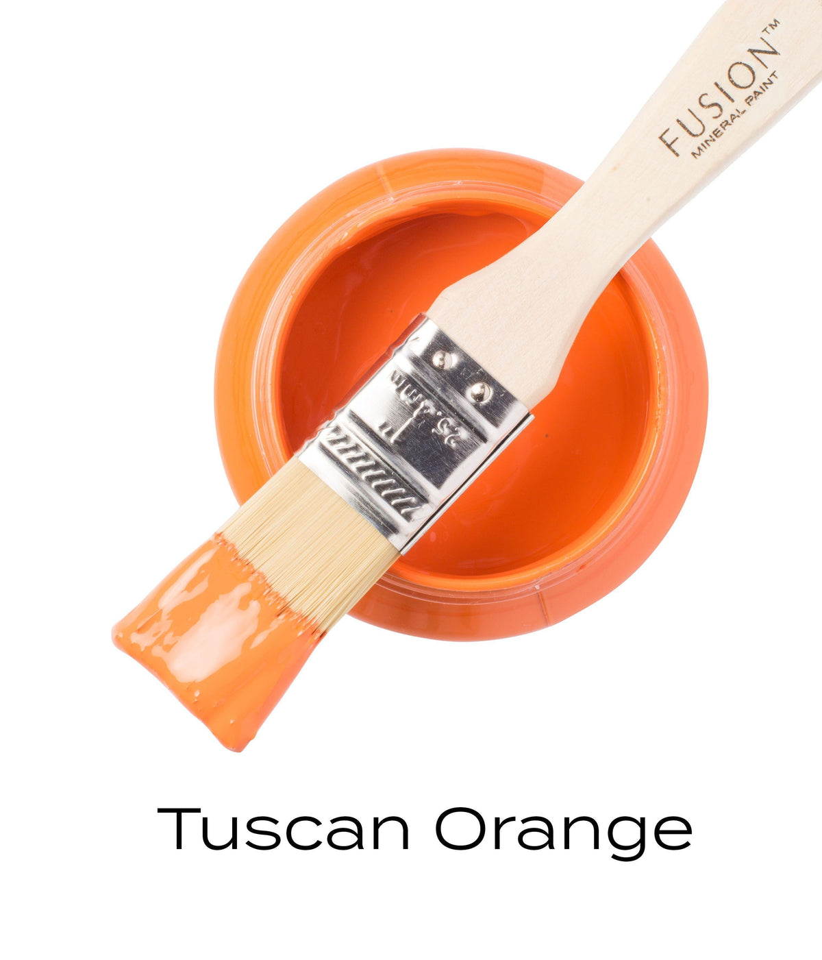 Brush with Tuscan Orange Fusion Mineral Paint (Seasonal) resting on open Fusion Mineral Paint jar.