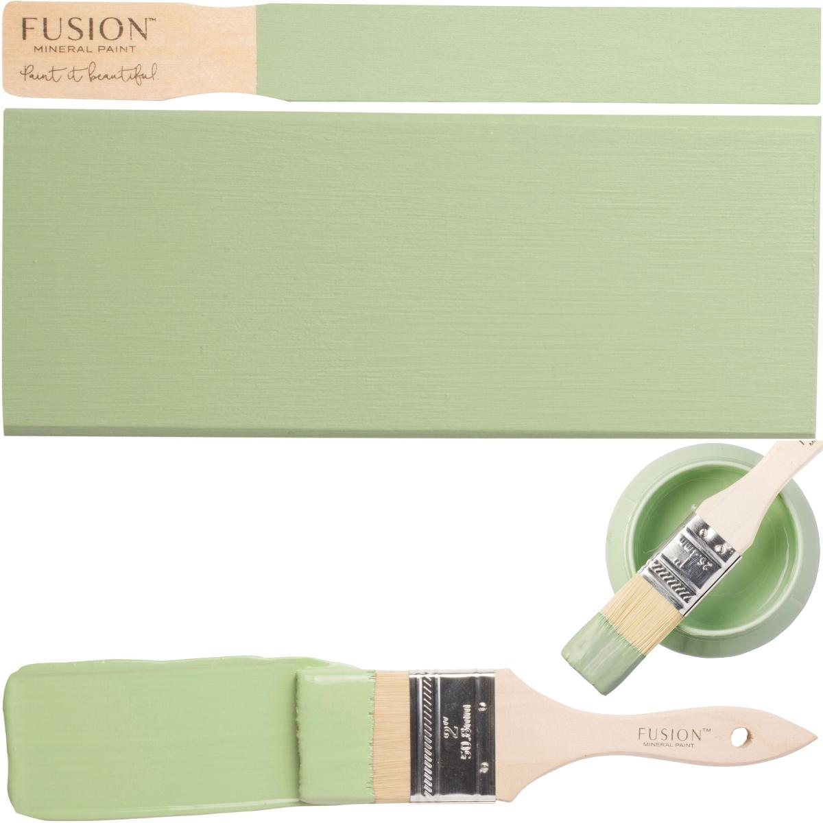 Paintbrush, board, and bowl of Fusion Mineral Paint Upper Canada Green (Seasonal).