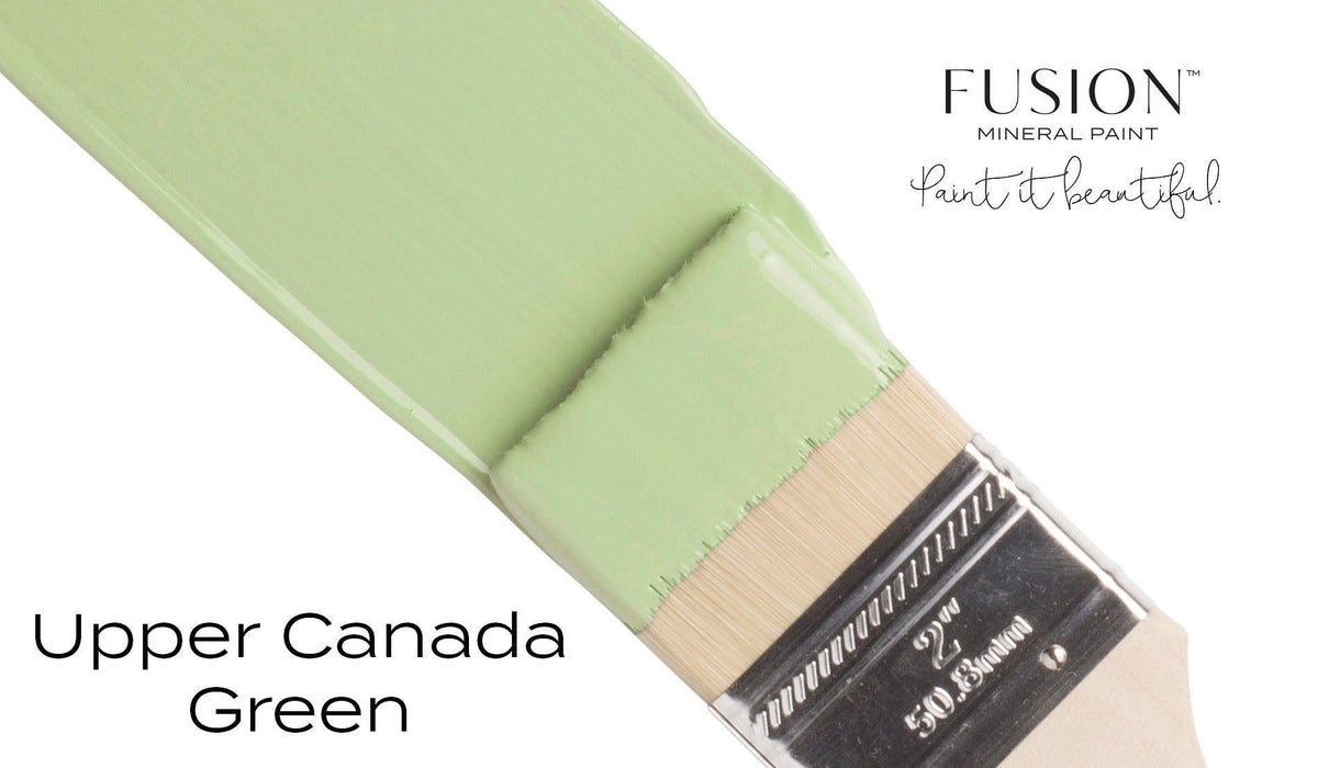 Brush with Upper Canada Green Fusion Mineral Paint (Seasonal); text: Upper Canada Green, Fusion Mineral Paint.