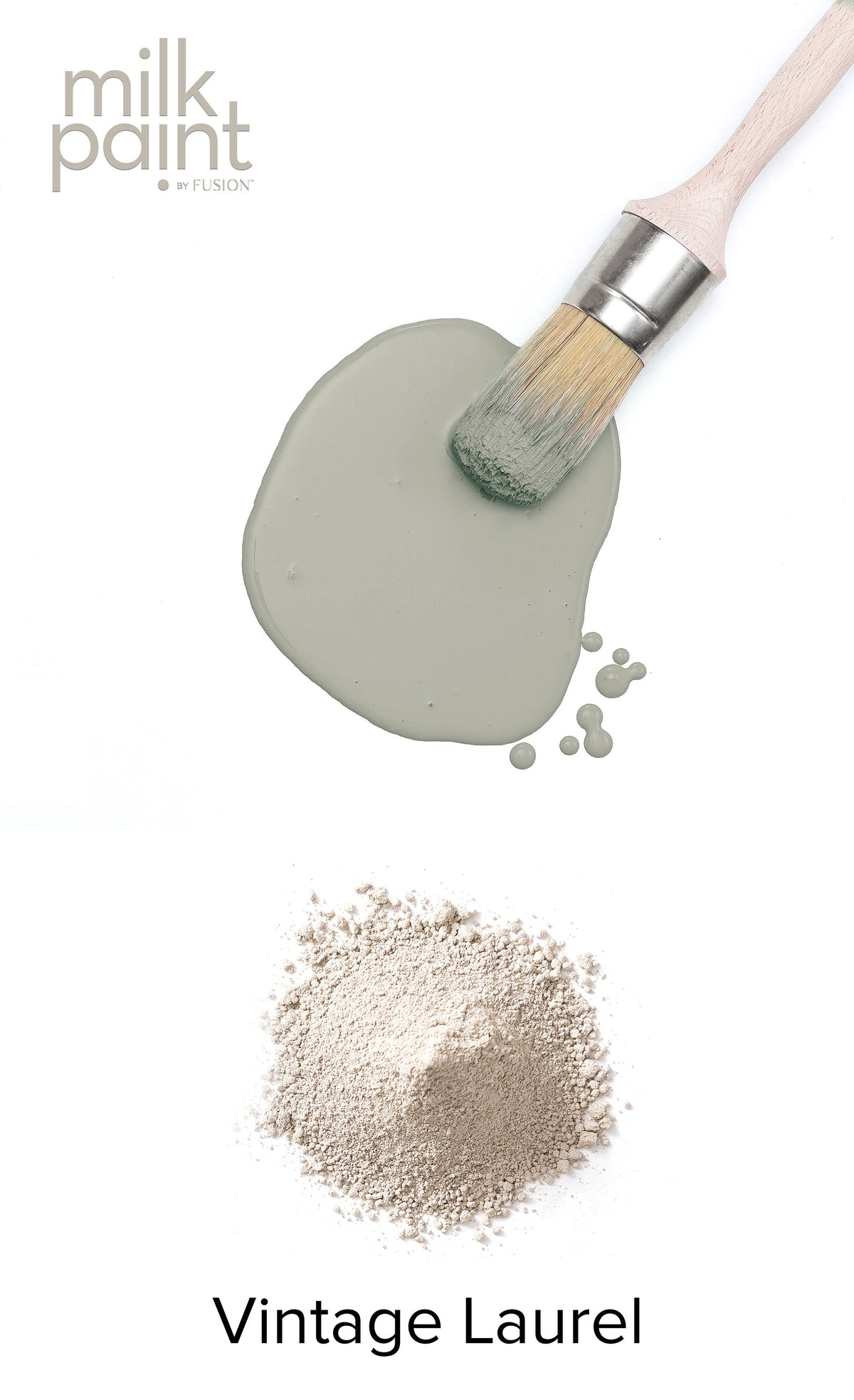 Paintbrush resting on Vintage Laurel Milk Paint by Fusion Mineral Paint, green-gray color with powder visible.