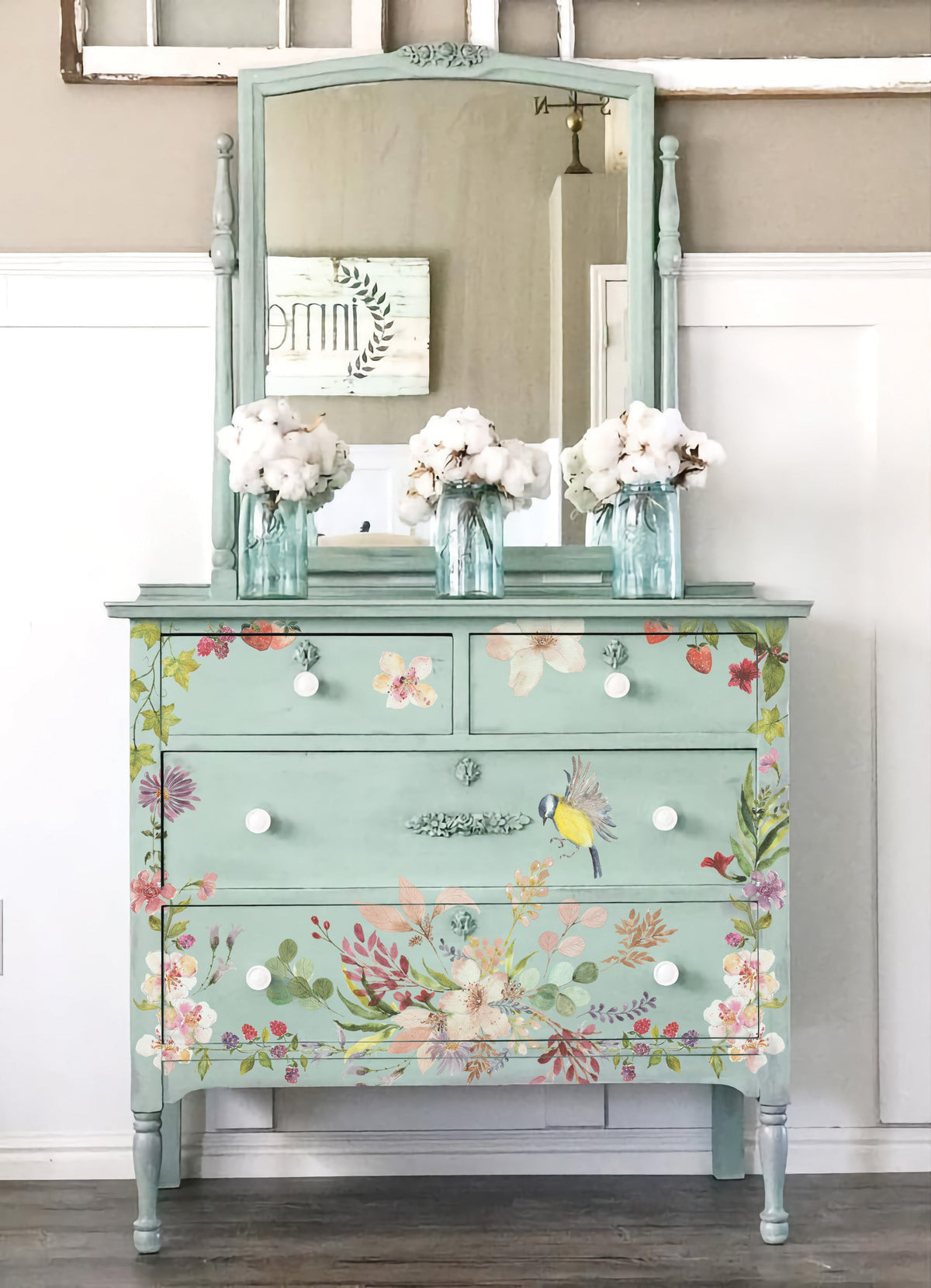 Mint dresser with I.O.D. Whispering Willow floral transfer, mirror, and white flowers.
