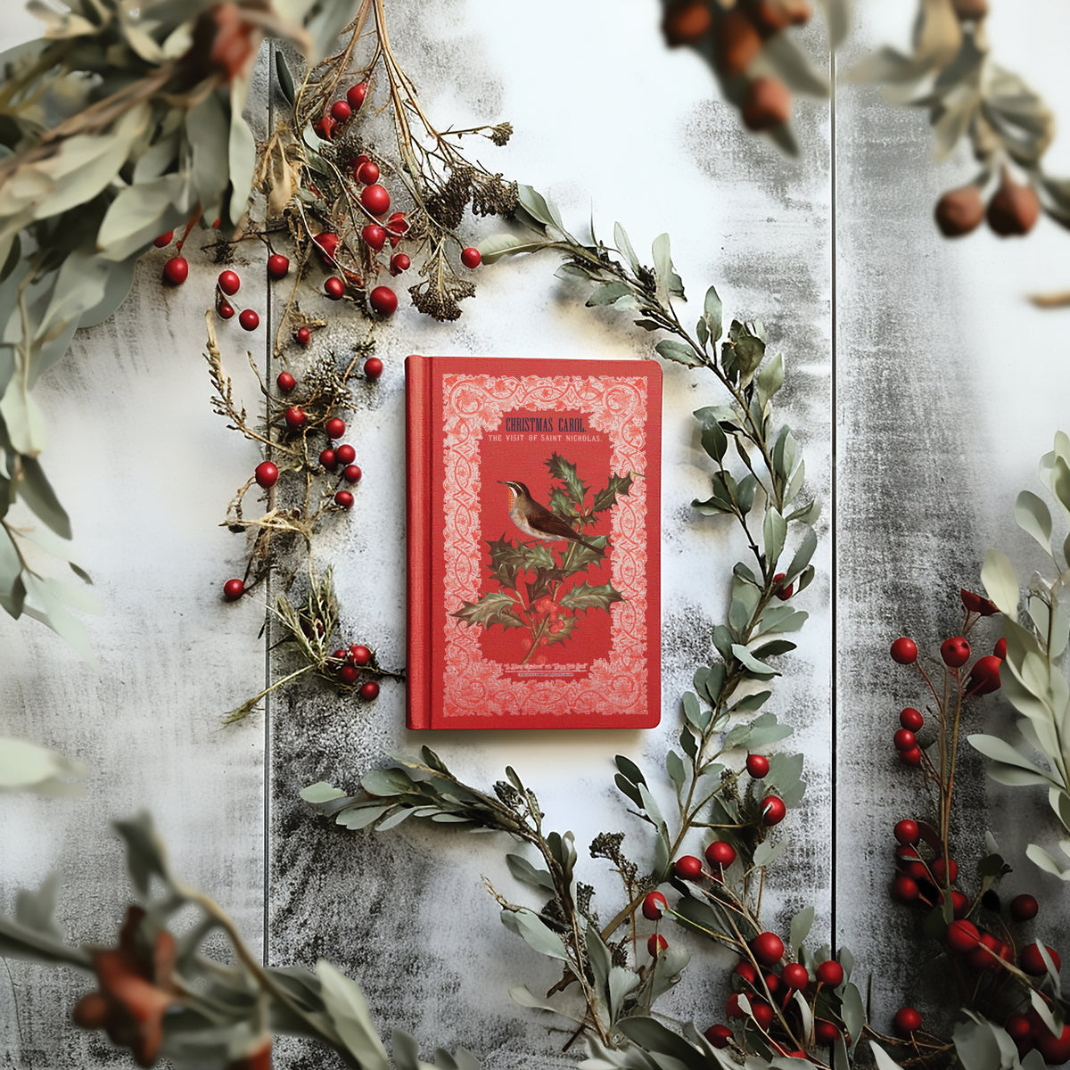 Red book with bird, featuring I.O.D.’s Winter Botanist Transfer 2025 Limited Release and vintage decor accents.