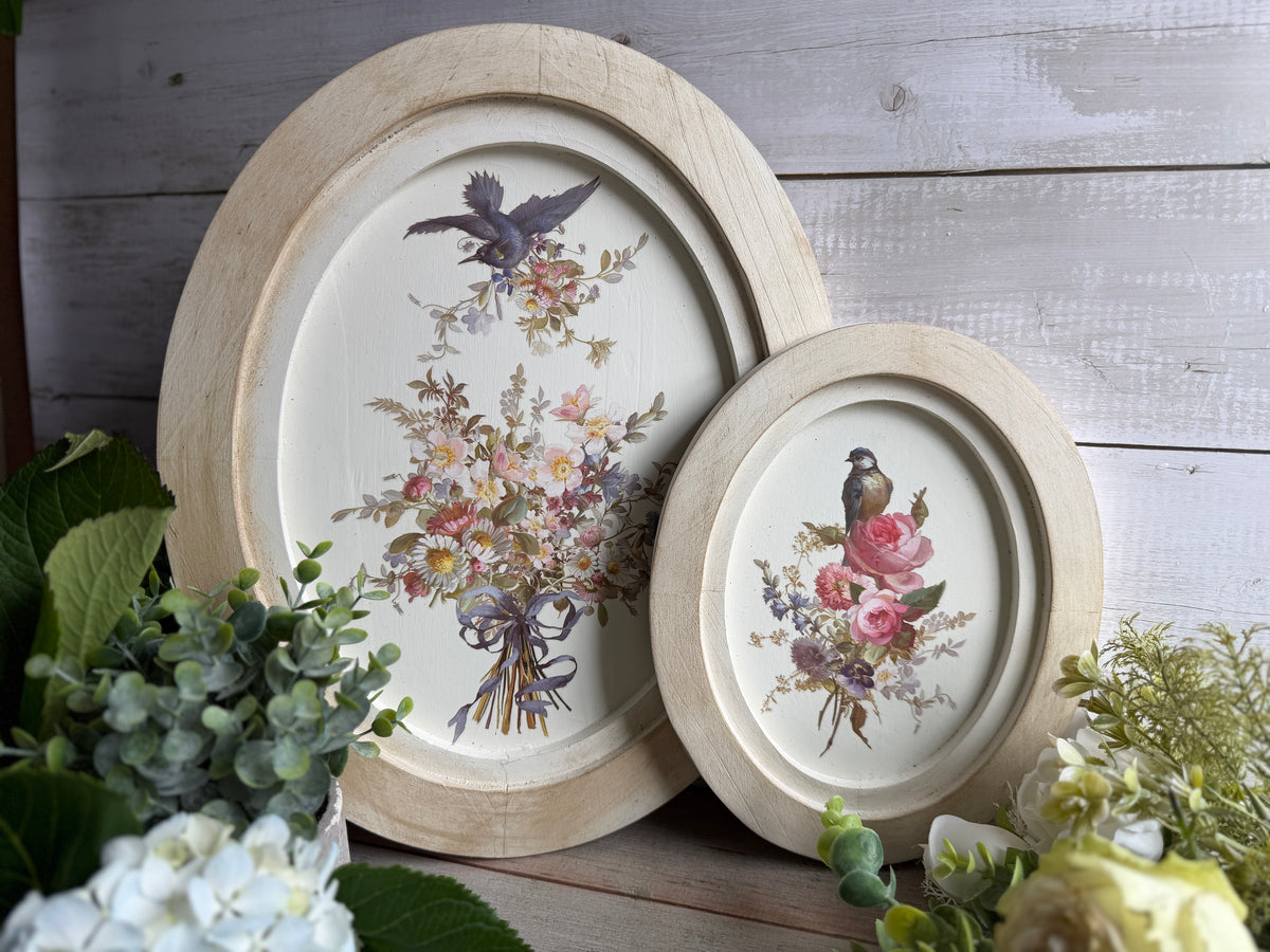 Two oval I.O.D. Wood Gallery Blanks with bird and floral designs, suitable for painting or crafts.