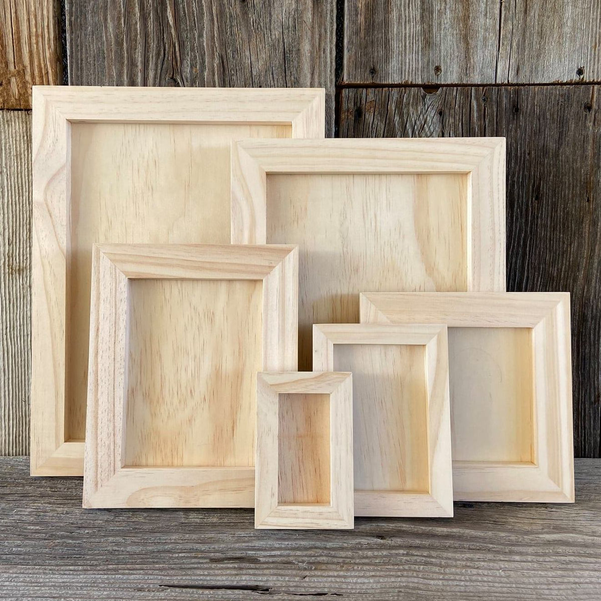 Five I.O.D. Wood Gallery Blanks by Iron Orchid Designs arranged together for crafting projects.