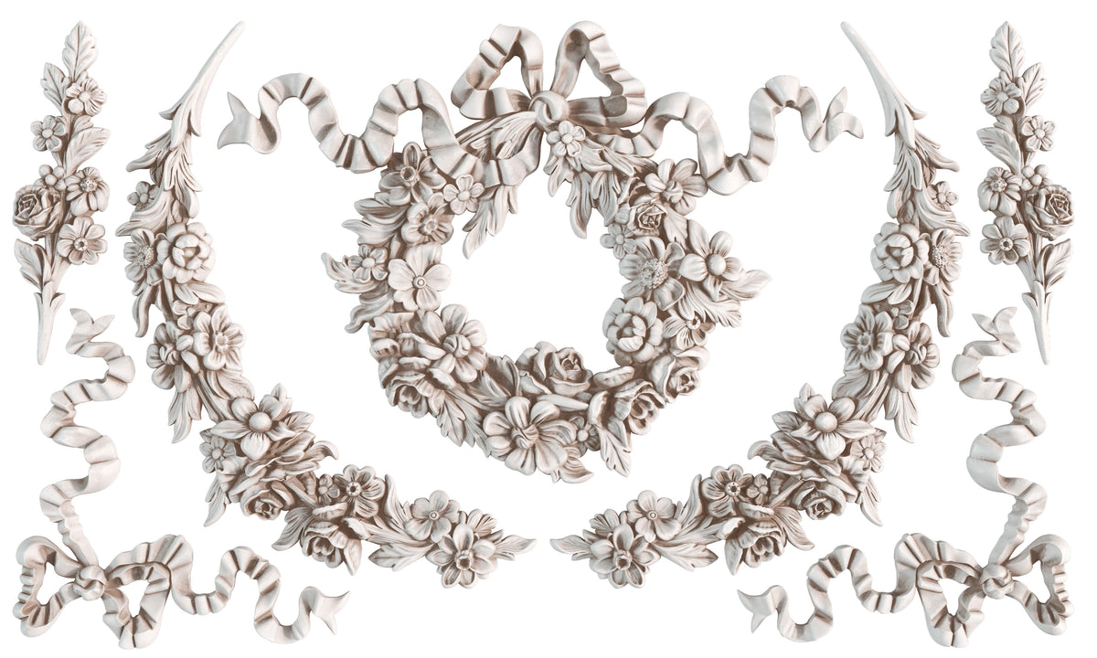 Symmetric floral and ribbon patterns formed with I.O.D. Wreath & Swags Mould for vintage-style decoration.