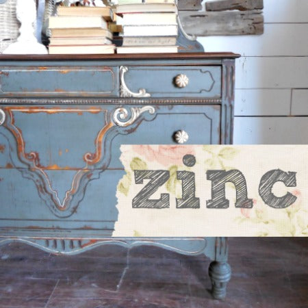 Blue vintage dresser in Old Fashioned Milk Paint Zinc with books stacked on top.