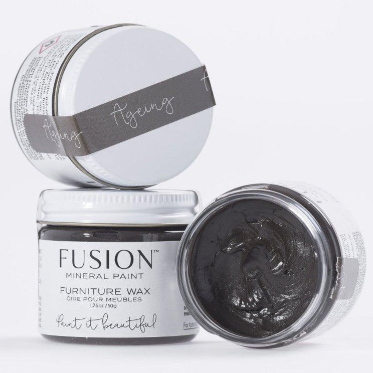 Three Fusion Mineral Paint Ageing Furniture Wax jars—one open with dark wax, two closed and stacked.