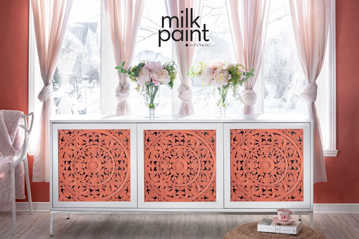 White sideboard with coral carved doors in Casa Rosa Milk Paint by Fusion Mineral Paint.