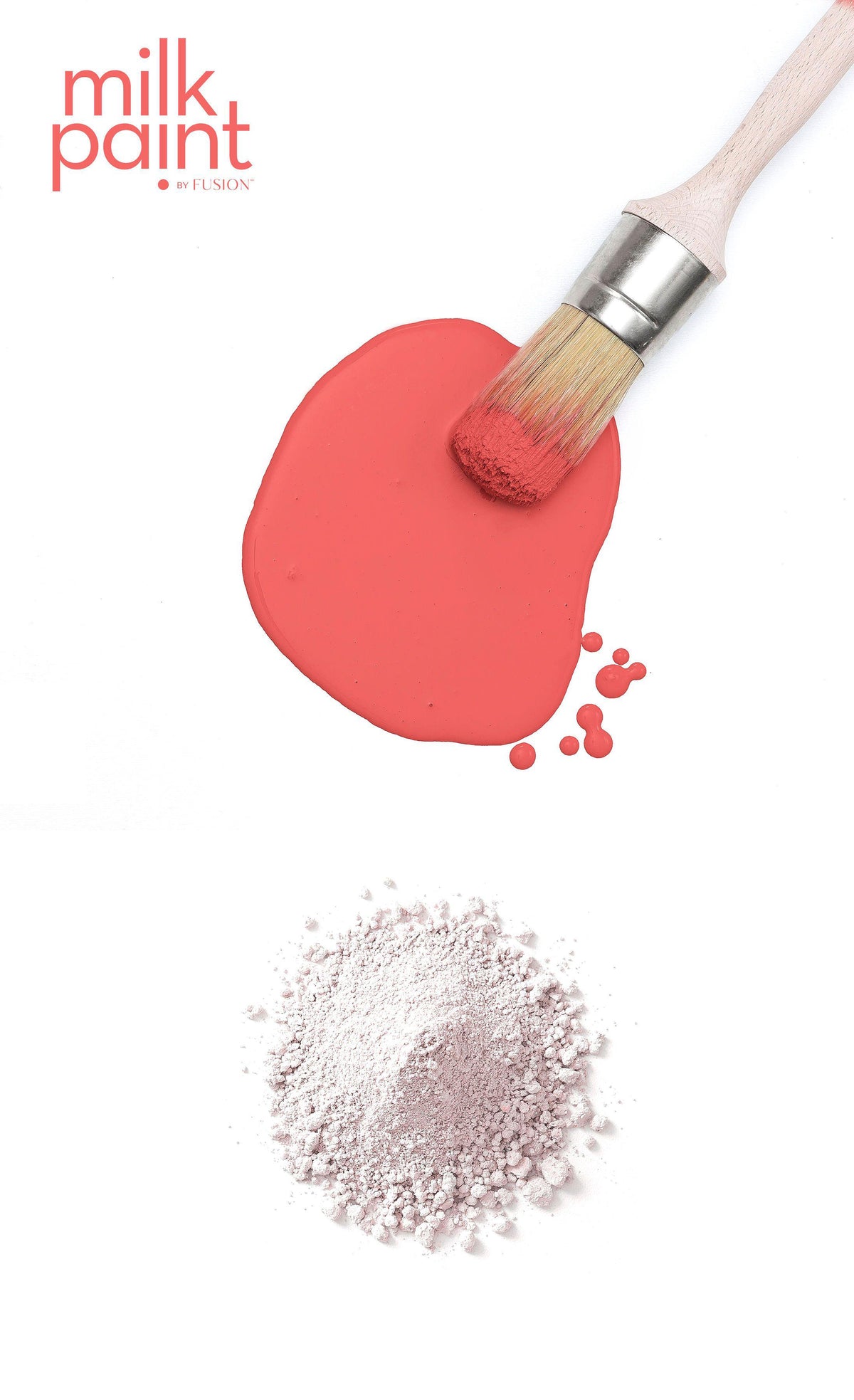 Paintbrush with Fusion Mineral Paint’s Casa Rosa Milk Paint on a plain white background.