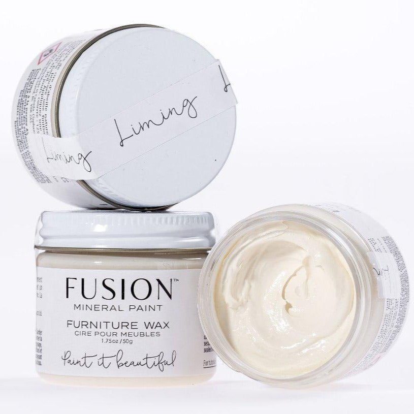 Two jars of Fusion Mineral Paint Liming Furniture Wax, one open showing wax and one closed.