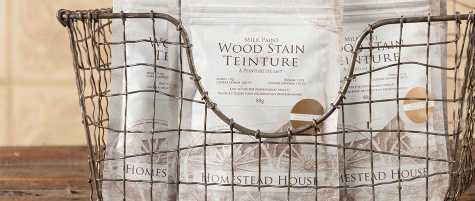 Wire basket holding three Fusion Mineral Paint Milk Paint Wood Stain bags for furniture restoration.
