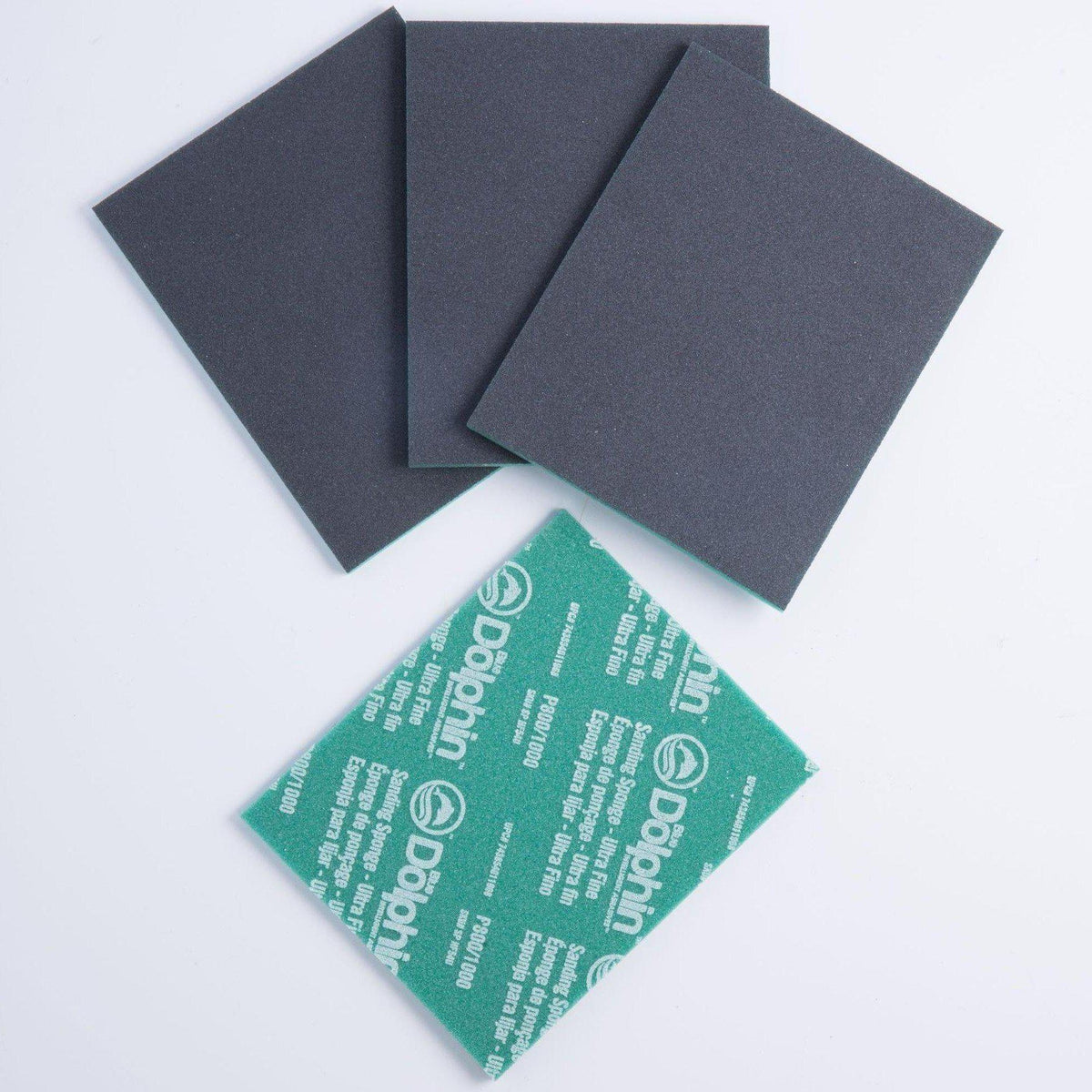 Four gray and green Fusion Mineral Paint P-Flex sponges displayed on a white surface.