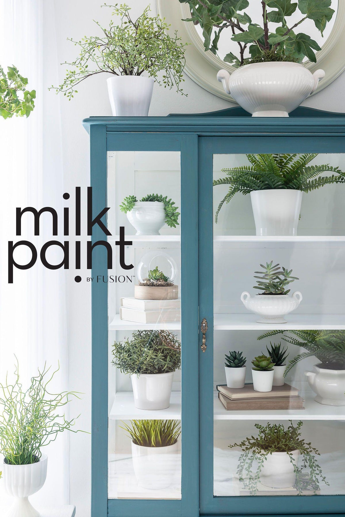 Teal cabinet with glass door, plants, books; “Terrarium Milk Paint by Fusion Mineral Paint” text on left.