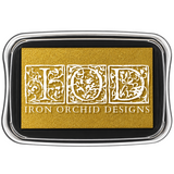 I.O.D. Metallic Ink Pad, gold shimmer, in clear case labeled Iron Orchid Designs with ornate white lettering.