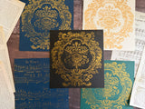 Five floral prints made with I.O.D. Metallic Ink Pads on colored paper, bordered by vintage book and music pages.