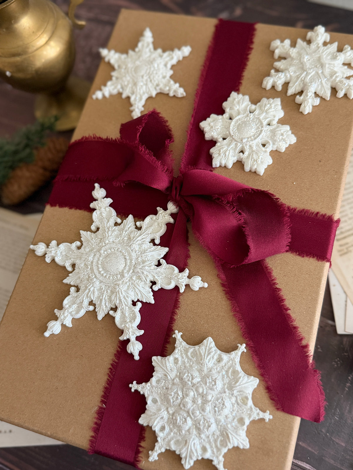 Brown gift box containing five I.O.D. Snowflakes Mould (2026 Limited Release) ornaments.