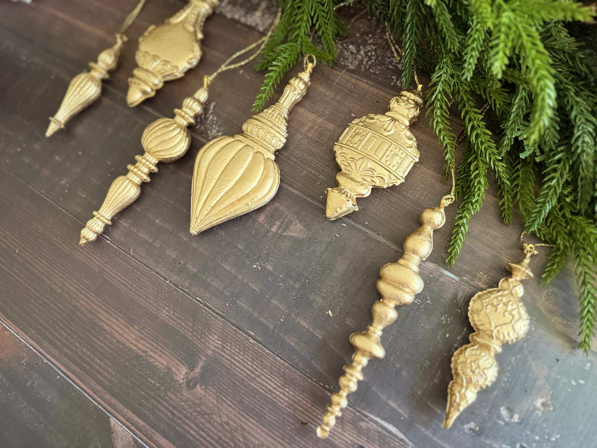 Six Baubles Mould ornaments by I.O.D. on dark wood with pine branches, Limited 2026 release.
