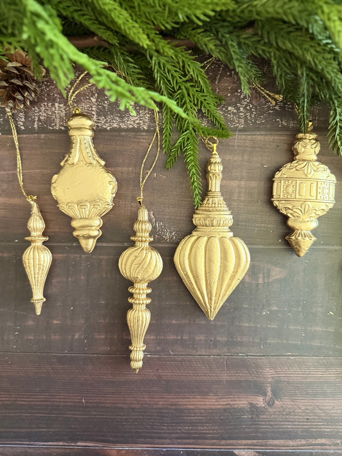 Five Baubles Mould ornaments by IOD, 2026 limited release, displayed hanging below greenery.