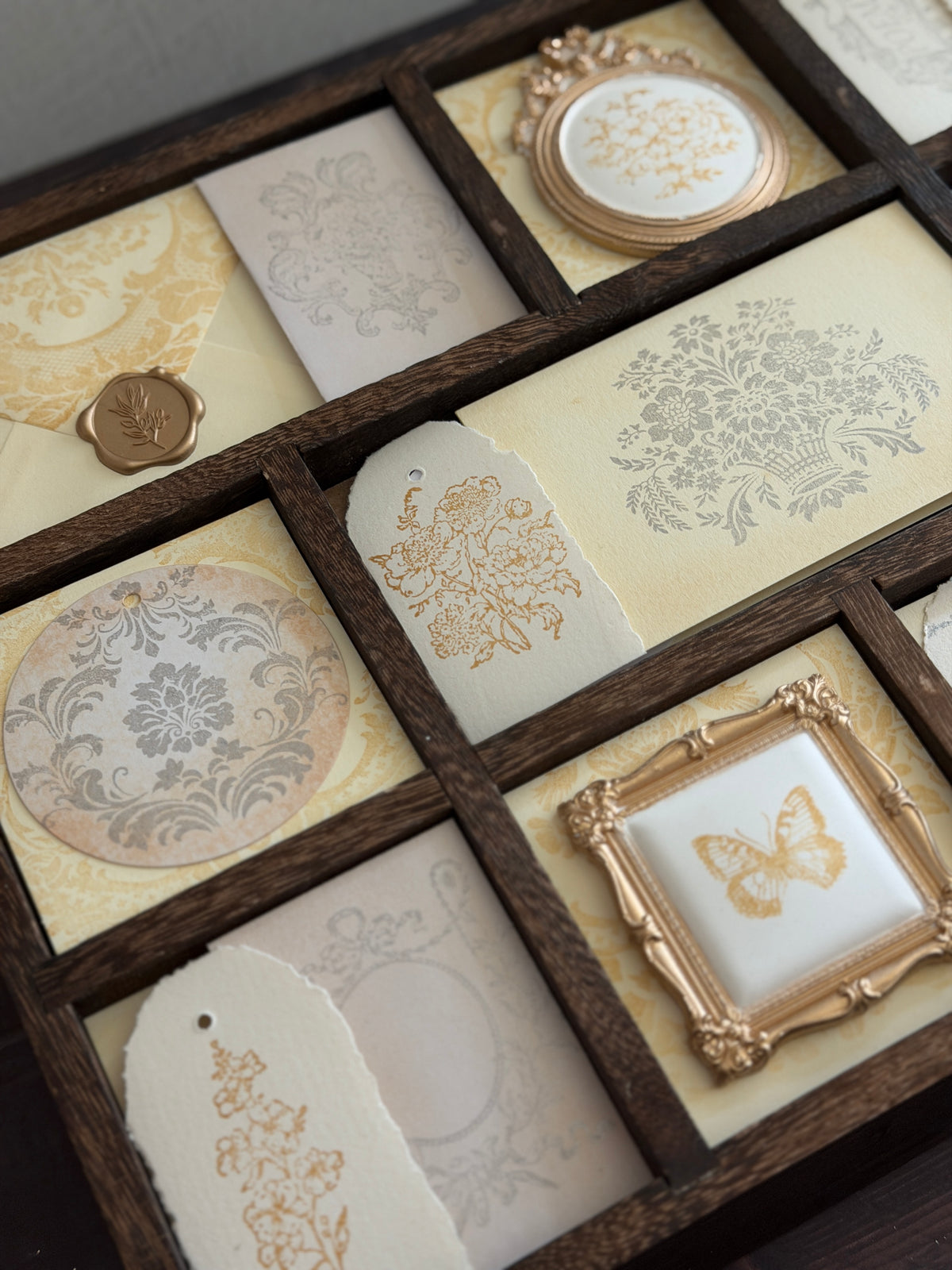 I.O.D. Metallic Ink Pads & Refills by Iron Orchid Designs displayed with ornate frames and vintage tags.