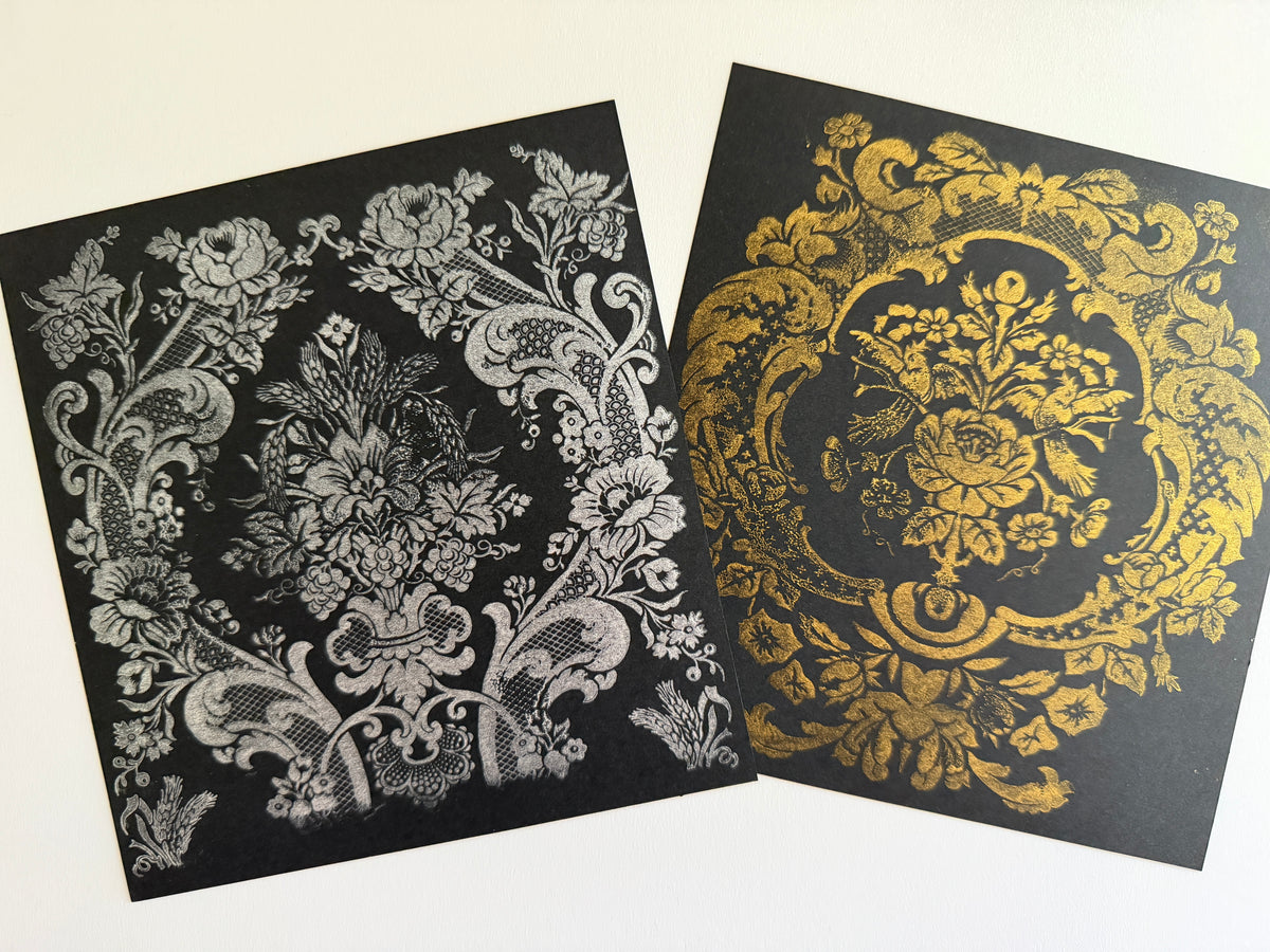 Two IOD Retired black cards, one with silver floral ink and one with gold, from Metallic Ink Pads & Refills by IOD.