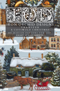 Snowy Christmas village with houses, trees, and A Cotswold Christmas Transfer by I.O.D. overlays.