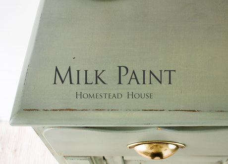 Green wooden dresser with brass handle, finished in Acadia Pear Milk Paint by Homestead House.