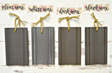 Four gray wood samples painted in Adelaide by Old Fashioned Milk Paint, waxed, each finished with a twine loop.