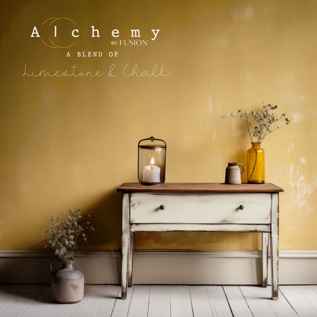 Rustic table in front of a yellow wall painted with Alabaster Alchemy by Fusion Mineral Paint.