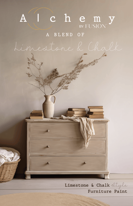 Beige dresser with books, a vase of dried flowers, and a folded blanket on top.