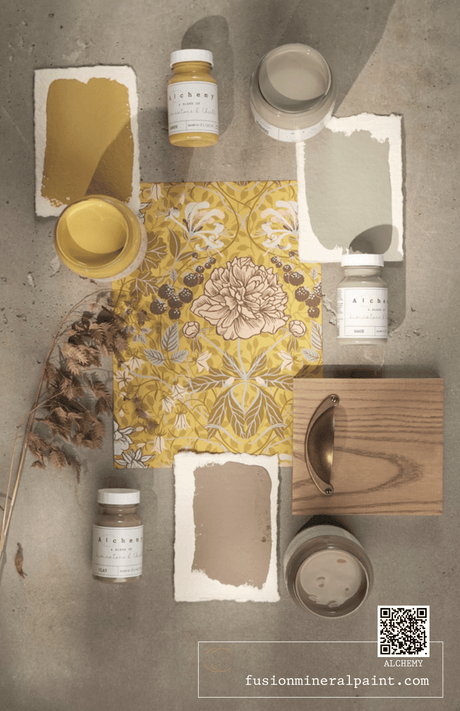 Alchemy by Fusion Look Book, with swatches, jars, grass, wood, and floral paper arranged flat.
