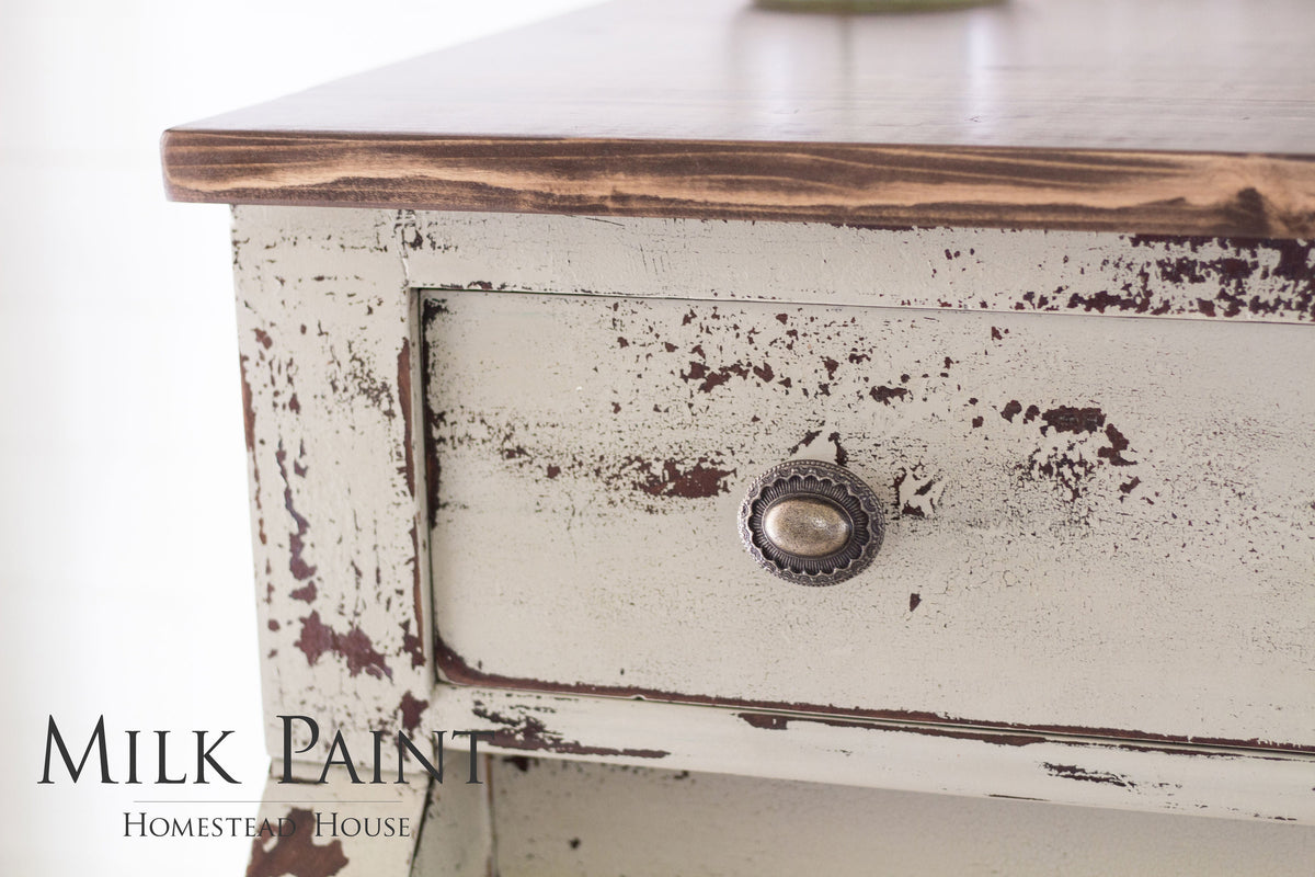 Distressed wood drawer with round knob, finished in Homestead House Algonquin Milk Paint.