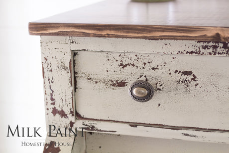 Distressed wood drawer with round knob, finished in Homestead House Algonquin Milk Paint.