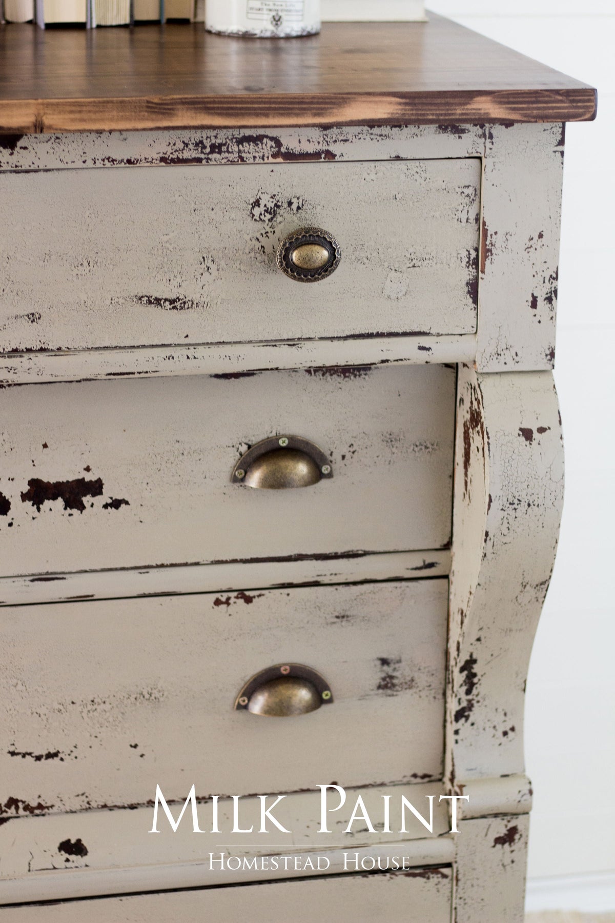 Distressed dresser painted Homestead House Algonquin Milk Paint, brass cup pulls, rustic wood top.