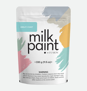Amalfi Coast Milk Paint by Fusion Mineral Paint, 330g pouch with pastel design and inhalation risk warning label.